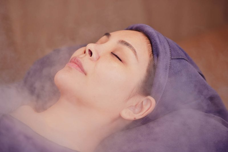 Hydrating face mist applied during acne scar care