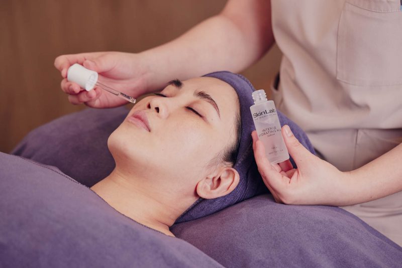 Hyaluronic acid serum applied during a hydrating facial