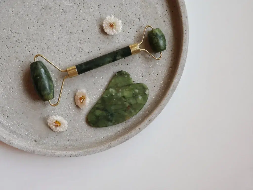 A gua sha and jade roller