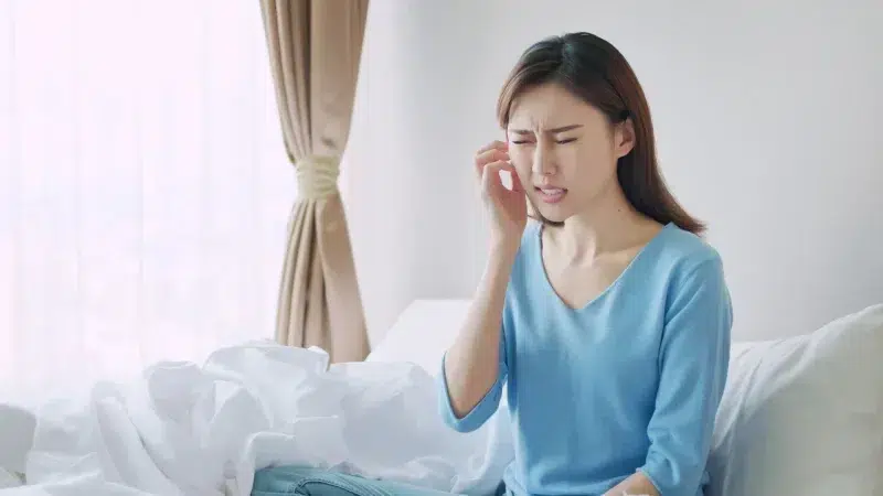 A woman with dry and uncomfortable skin